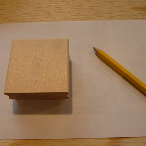 Wooden block with Speedball Speedy Carve attached, pencil and paper