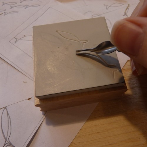 Carving the outlines of the design
